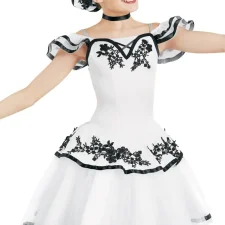 White tutu with black embellishments and large hair accessory