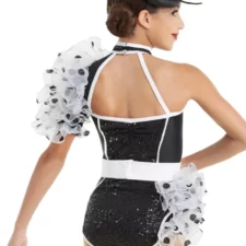 Black and white sequin leotard with spotty sleeves and bustle and fascinator hat