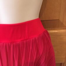 Red pleated cascade skirt with attached briefs