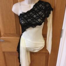 Cream one sleeve leotard with black lace crossover and net bustle