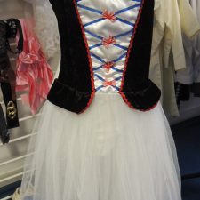 Black, blue and white dress with white tutu skirt and lace up front detail