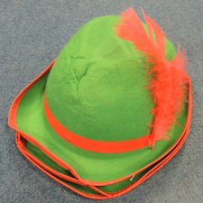 Green and red hat with feather