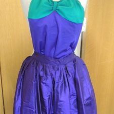 Purple and green silk skirt, leotard and straw hat