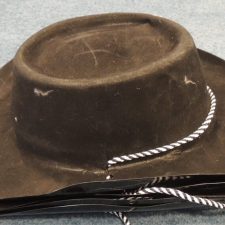 Black plastic suede cowboy hat