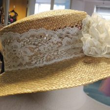 Straw hat with lace flower