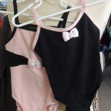 Black and pink leotard with bow