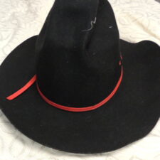 Black cowboy hat with red band