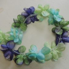 Green, purple and aqua flower hairpiece