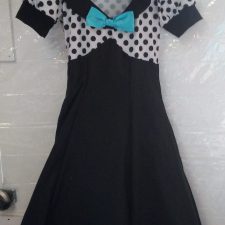 Black and white dress with spotty bodice and turquoise bow