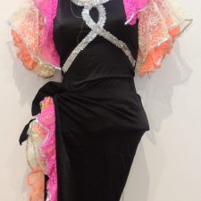 Black leotard and can can skirt with orange and pink ruffle and flower headband