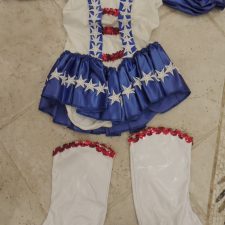 Blue and white skirted leotard with stars and boot covers