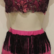 Pink and black crop top with floral applique and fringe skirt