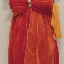 Red and orange dress with rouched bra top and scarf hem