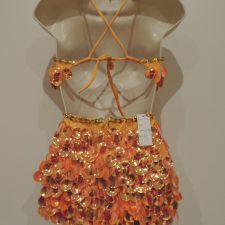 Orange dress with hanging disc sparkles