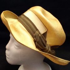 Tan hat with striped bow