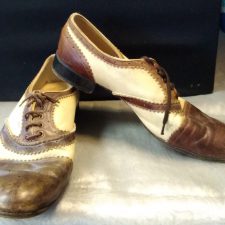 Brown and tan wing tip shoes
