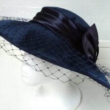 Navy hat with large satin bow and net