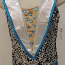 Turquoise and black biketard with silver sequins and large white collar