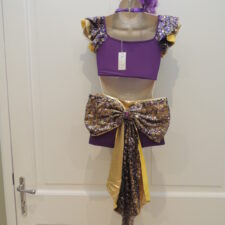 Purple and gold iridescent crop top and bikeshorts with large bow on back