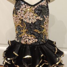 Black and beige sparkle skirted leotard with ruffled skirt and straps and sequin floral bodice