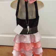 Peach and black leotard with mesh detail and ruffled bustle