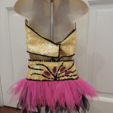 Yellow and pink sparkle crop top and skirt with black line detail