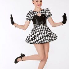 Black and white print skirted leotard with puff sleeves and sequin bodice