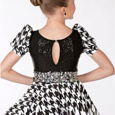 Black and white print skirted leotard with puff sleeves and sequin bodice