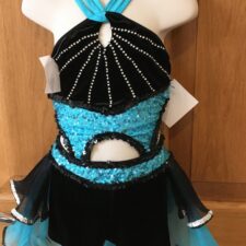 Turquoise and black biketatd with starburst sequin pattern and net bustle