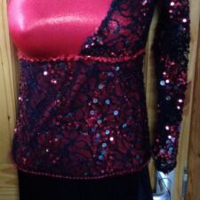 Red and black sequin skirted leotard with fringe