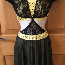 Black and yellow skirted leotard with lace over top