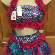 Pink and turquoise sequin crop top and skirt with ruffle accents