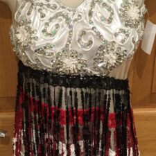 Black, white and red sequin skirted leotard with fringe skirt