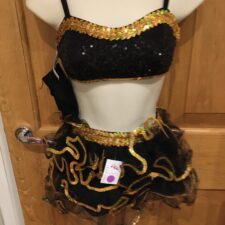 Black and gold ruffle crop top and skirt
