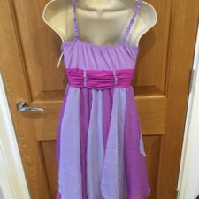 Lilac and purple skirted leotard with gathered bodice and handkerchief style hem