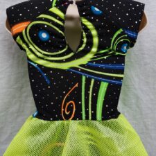 Neon green and black space age biketard with plastic fishnet skirt and padded shoulders