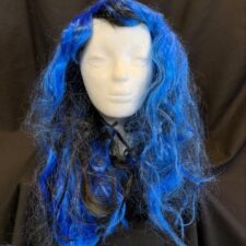 Bright blue and black curly wig with black ribbon
