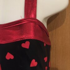 Black and red metallic skirted leotard with hearts design