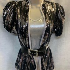 Silver biketard with black and silver belted jacket