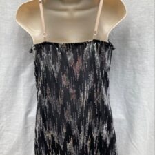 Black and metallic silver skirted leotard with draped neckline
