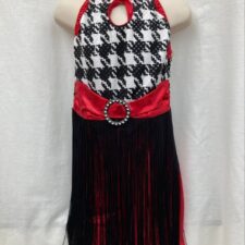 Red, black and white skirted biketard with fringe and boot covers