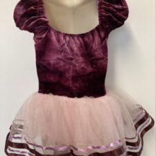 Purple velvet skirted leotard with puff sleeves and floral detail