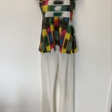 White  faux leather trousers and multi-coloured top