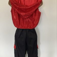Red sparkle hooded sleeveless jacket and black trousers