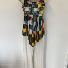 White  faux leather trousers and multi-coloured top
