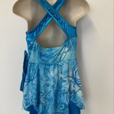 Turquoise and blue leotard with swirl pattern and metallic shorts