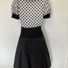Black and white dress with spotty bodice and turquoise bow and underskirt