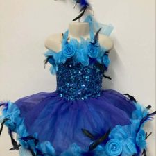 Bright blue and turquoise skirted leotard with sequin bodice, flowers and feather detail