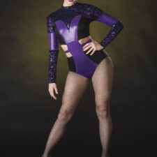 Metallic purple and leather look black sequin leotard with cut out sides and back