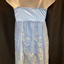 Pale blue skirted leotard with white lace design
